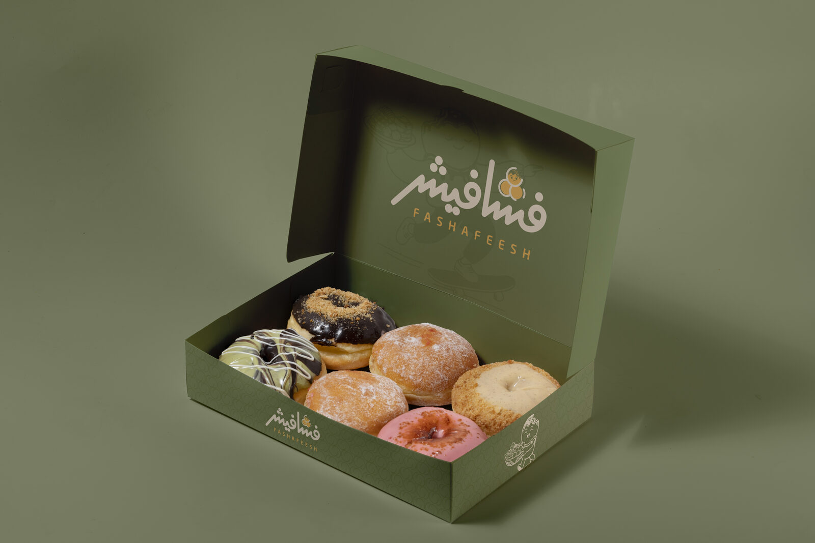 Open olive green donut box with skateboarding Fashfoosh silhouette on the lid and six filled donuts inside